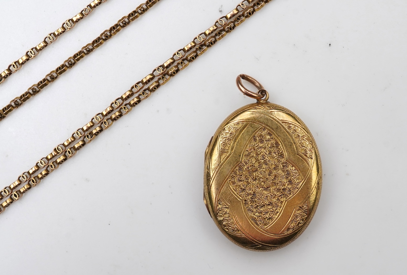 A Victorian gold locket and chain, late 19th century